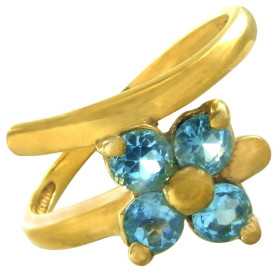 Bague or et fleur de topazes bleue