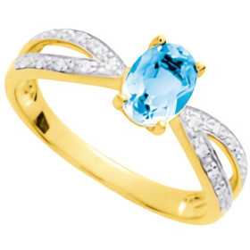 Bague en or jaune et rhodium avec topaze bleue 5 x 7 mm et zirconium